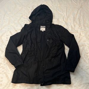 a new day | black rain coat